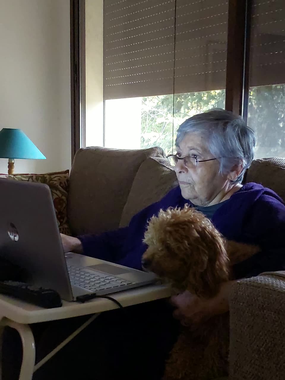 Frieda Haddad Abs with her dog at home